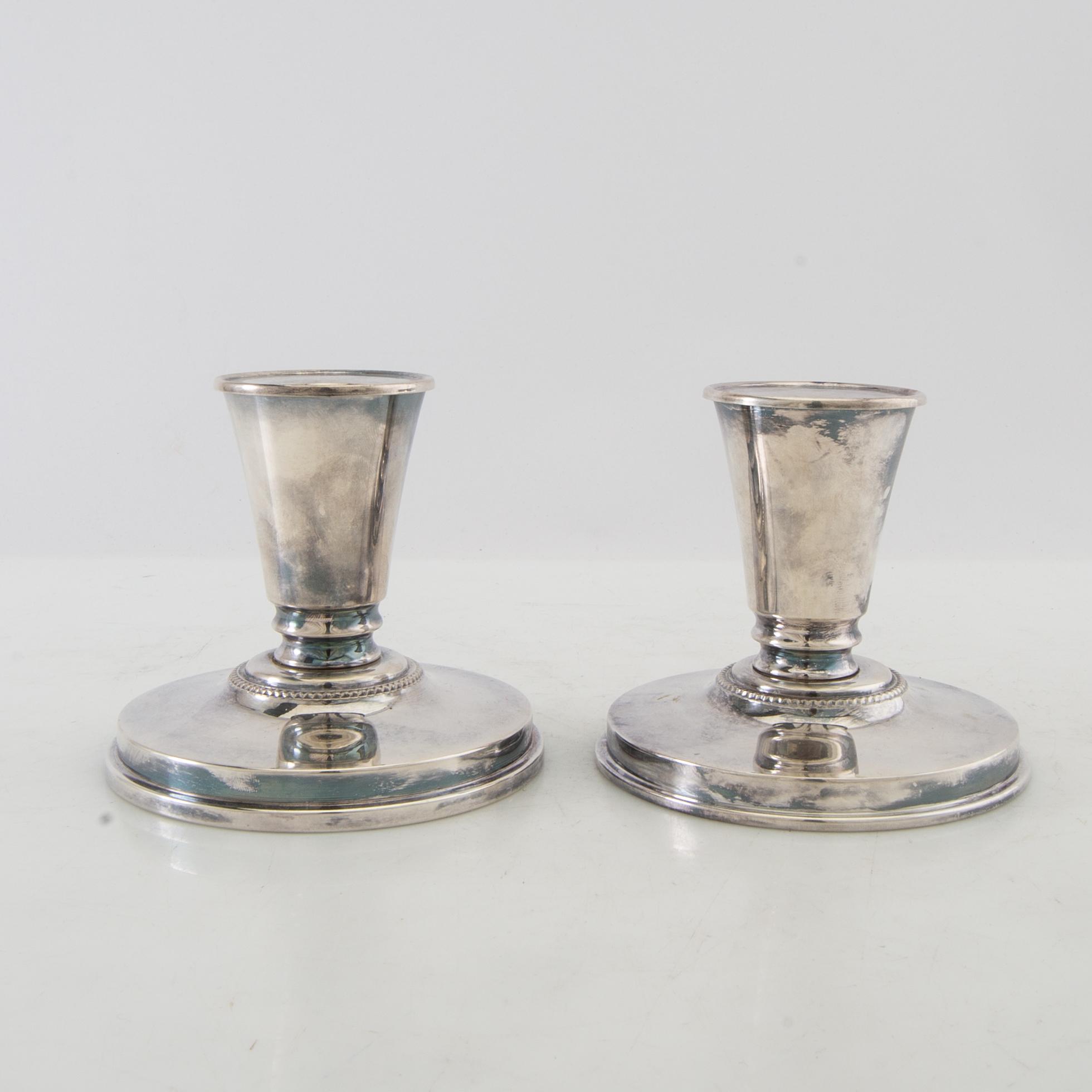 Candelsticks, a pair of silver-plated metal, first half of the 20th century.