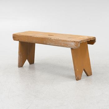 A painted bench, circa 1900.