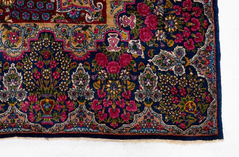 A semi-antique Kirman carpet, south Persia, c. 440 x 279 cm.