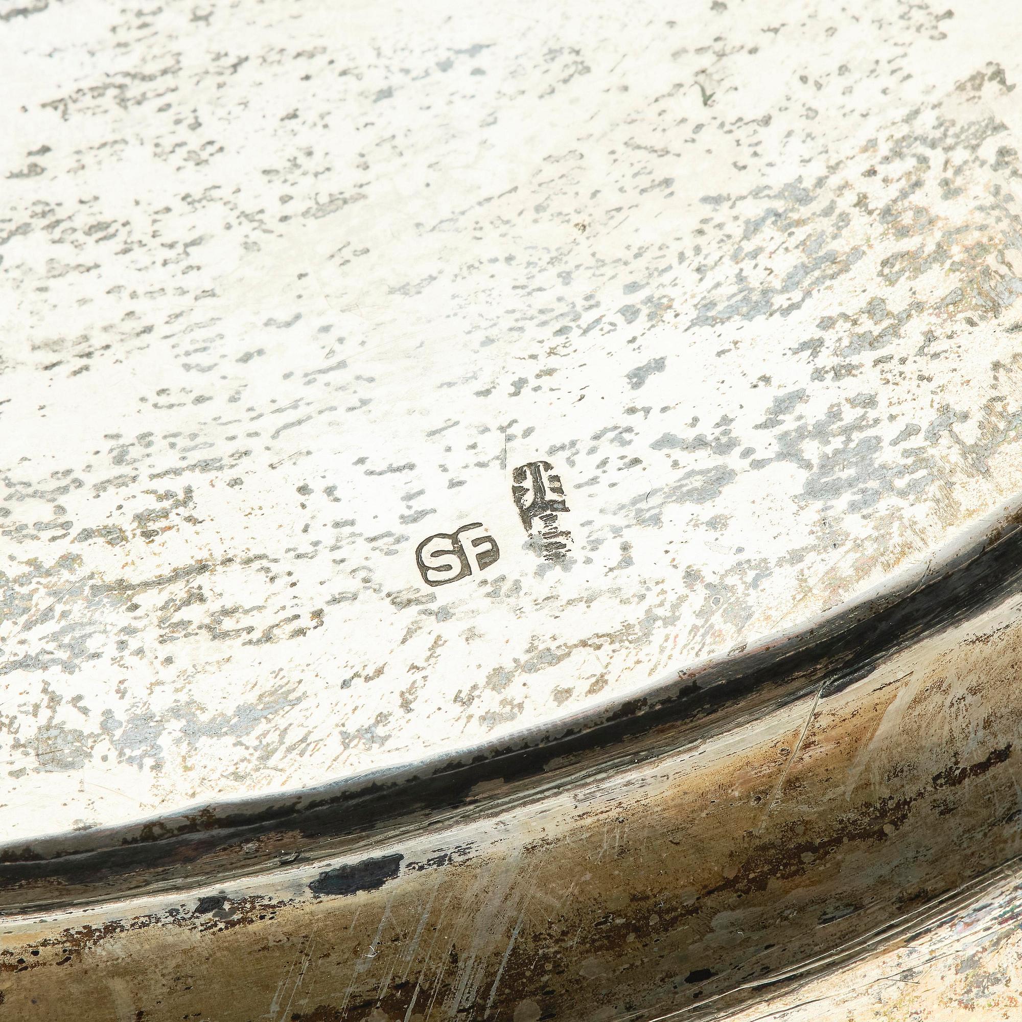 A lobed silver tray on four feet, Shanghai, Singfat, China Trade.