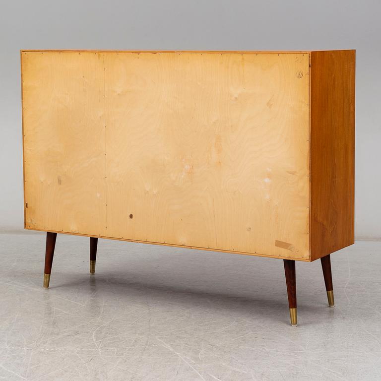 A late 20th Century teak veneered sideboard.