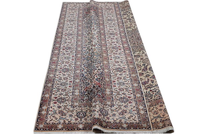 A carpet, Nain, part silk, 6 laa, c. 343 x 252 cm.
