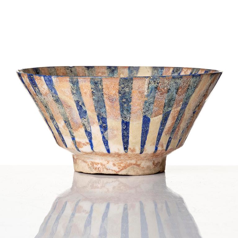A cobalt glazed radila design pottery bowl, Persia (Iran), 12th/13th century.