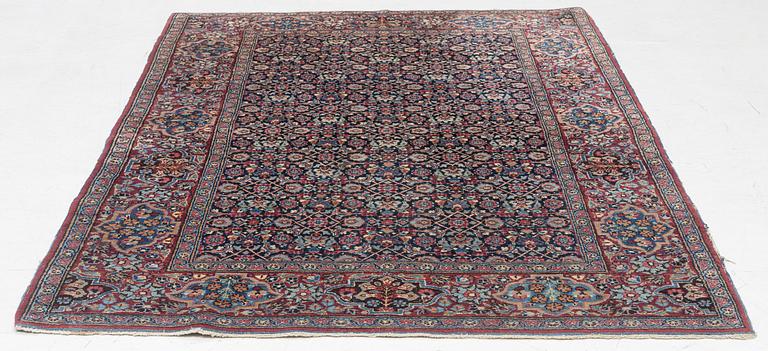 A rug, probably Meshed, semi-antique, c. 180 x 125 cm.