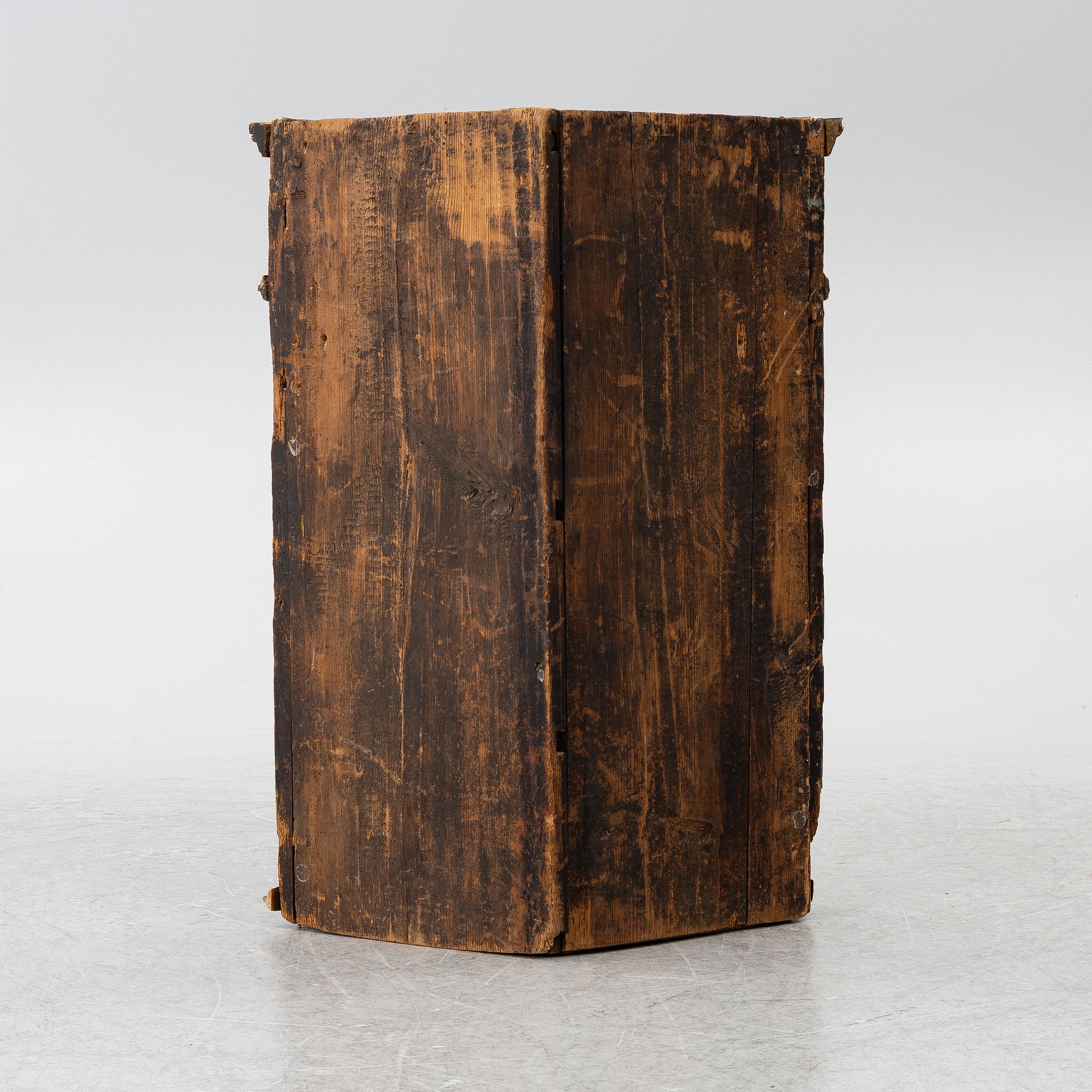A corner cabinet, 18th Century.