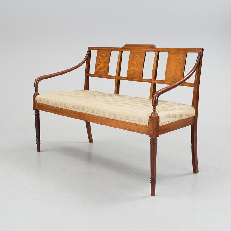 A 1920/30s Swedish Grace sofa, a pair of chairs, a pair of armchairs and a table veneered with mahogany.