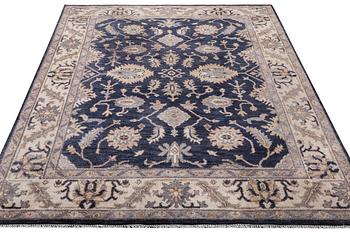 An oriental carpet of Mamluk design, c. 300 x 245 cm.