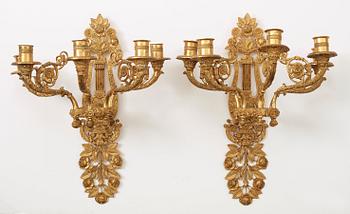 A pair of French 19th century gilt bronze five-light wall-lights.