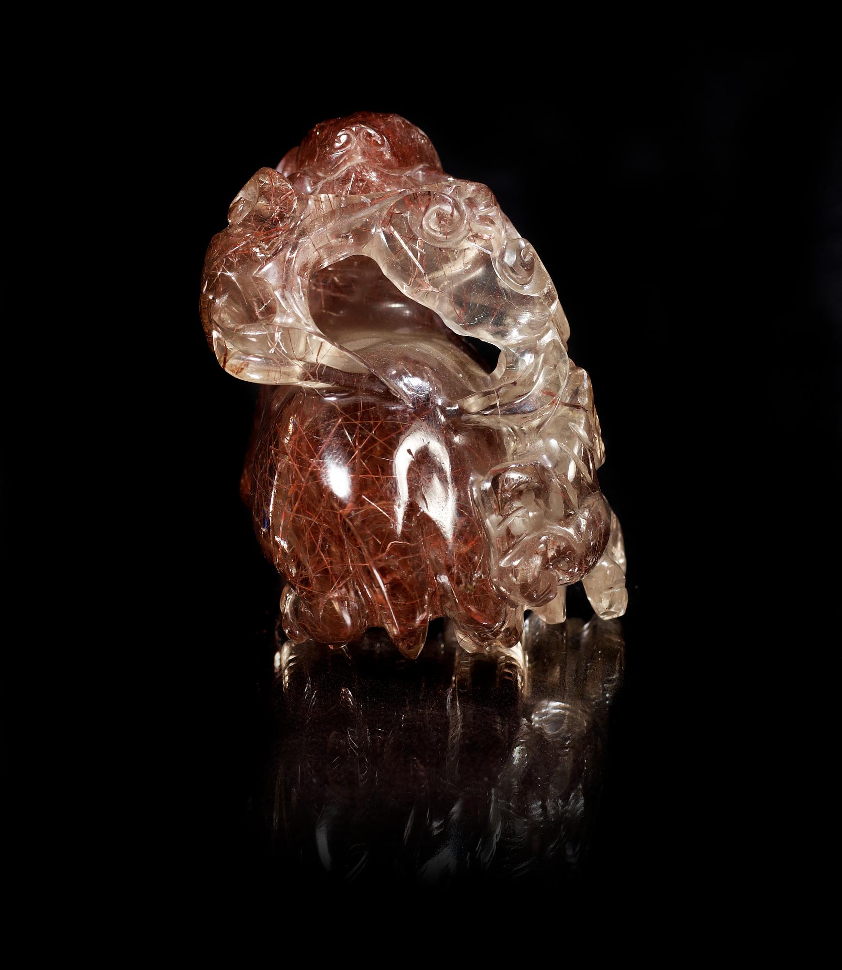 A carved quartz figure of a reclining deer with a dog and som fungus, China, early 20th Century.