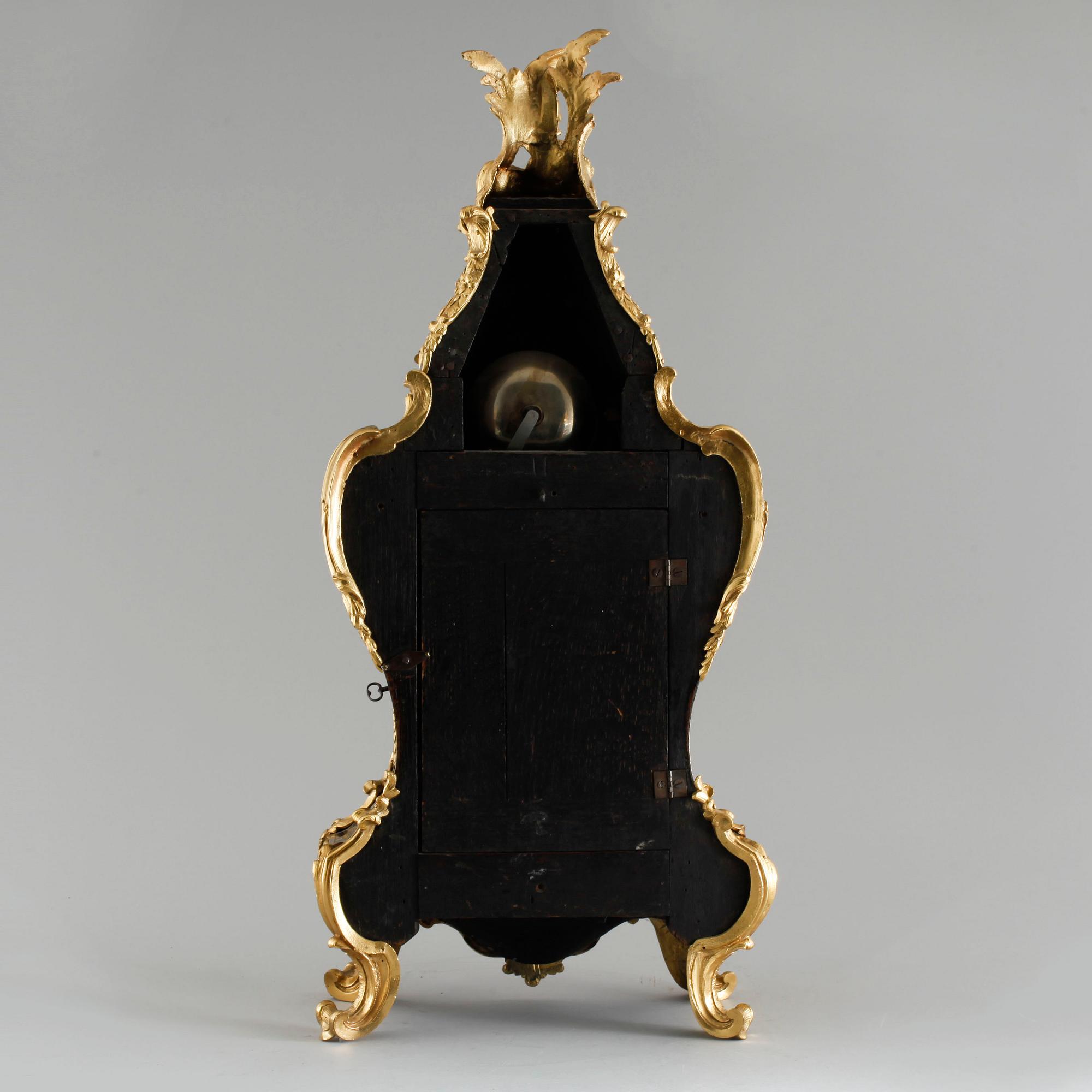 A 19th century mantle clock in the style of Louis XV.