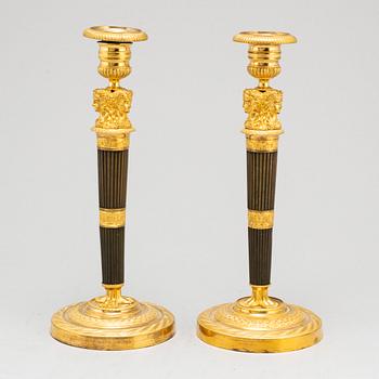A pair of French Empire candlesticks, early 19th century.