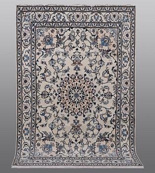 A rug, Nain, part silk, 238 x 163 cm.