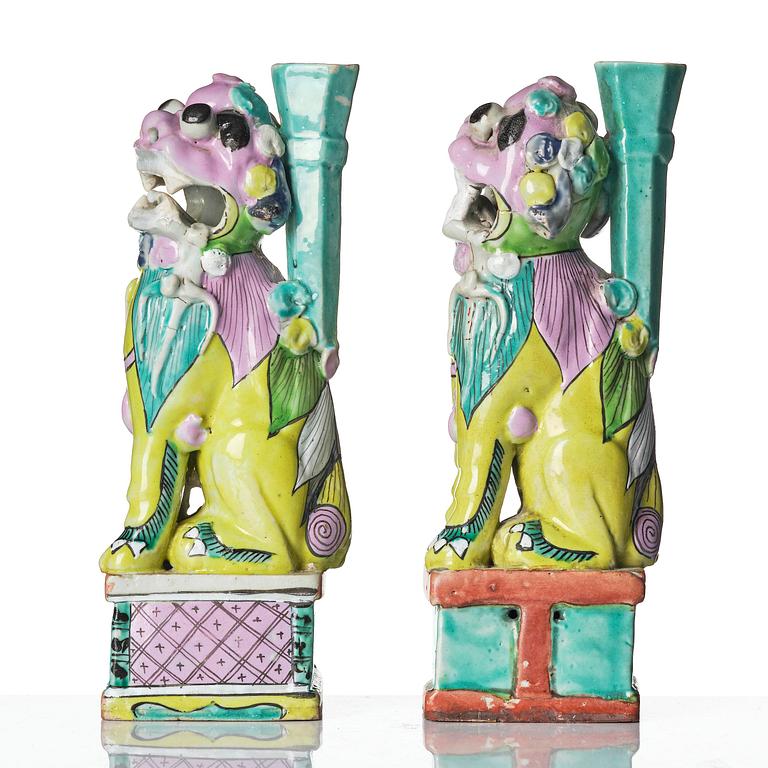 A pair of famille rose 'buddhist lion' joss stick holders, Qing dynasty, circa 1800.