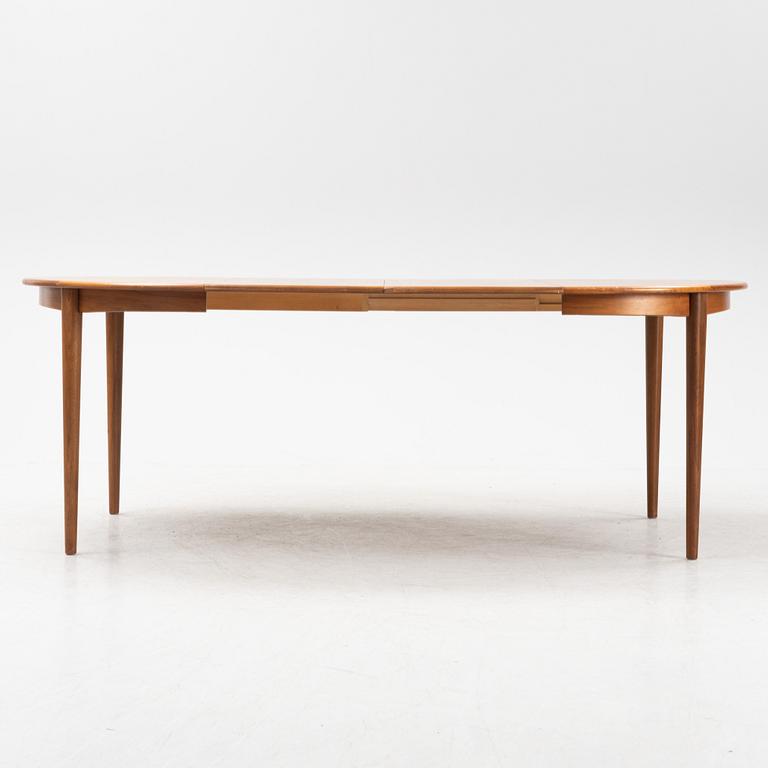 A teak and walnut dining table, second half of the 20th Century.