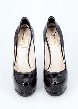 A pair of lady shoes by Yves Saint Laurent.