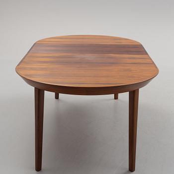 A 1950s/1960s rosewood veneer table.