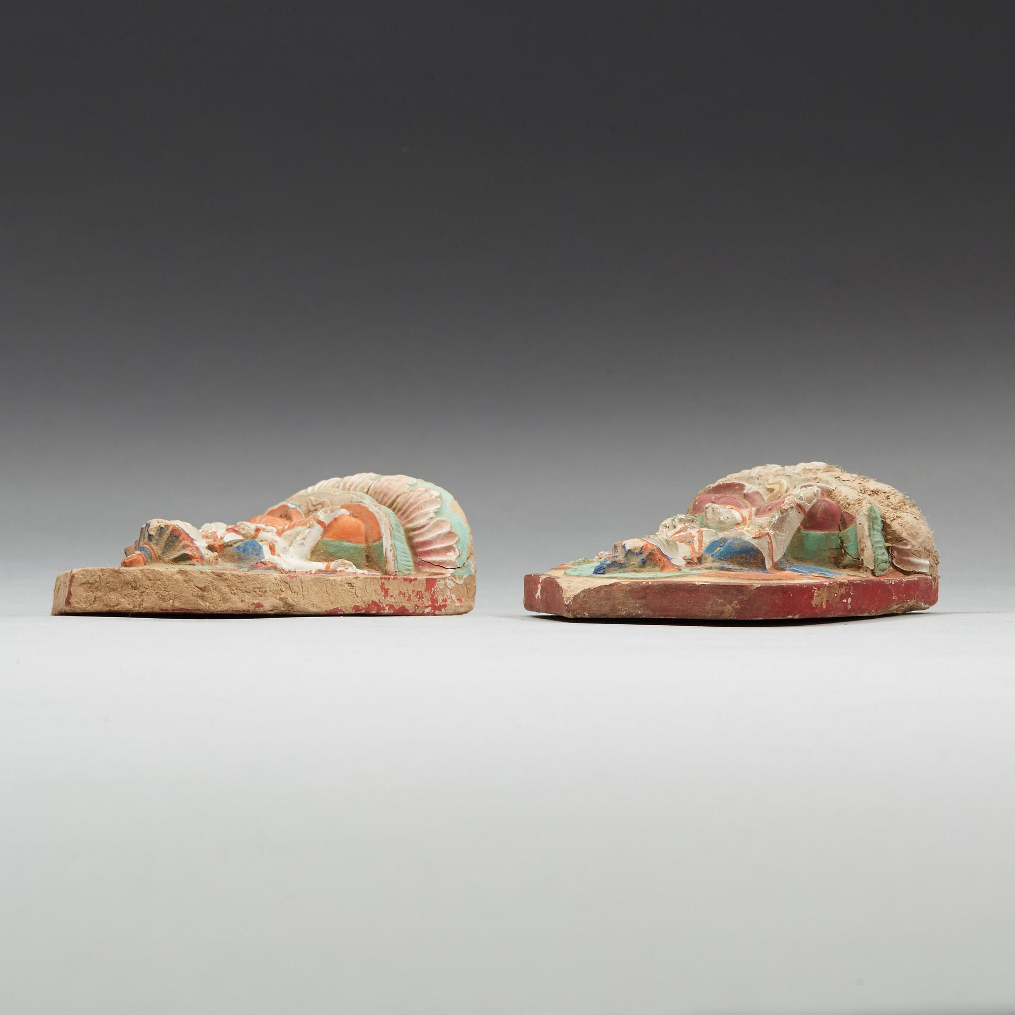 Two clay tsa-tsas, Tibet, 18/19th Century.