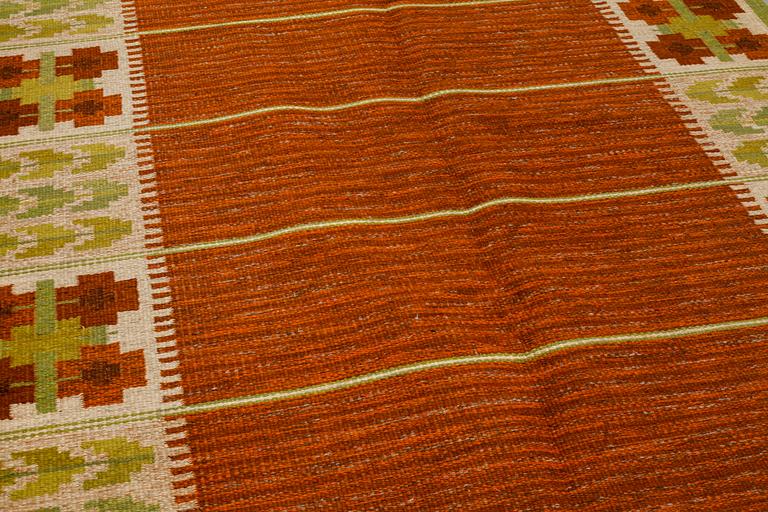 A flat weave by Berit Woelfer, signed BW, third quarter of the 20th century, 238 x 197 cm.