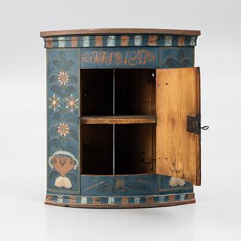 A folk art corner cabinet from Delsbo, Hälsingland dated 1847.