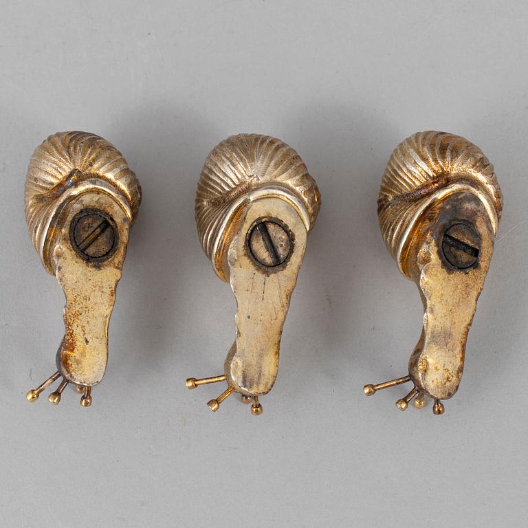 A set of three silver gilt salt-cellars, unmarked.