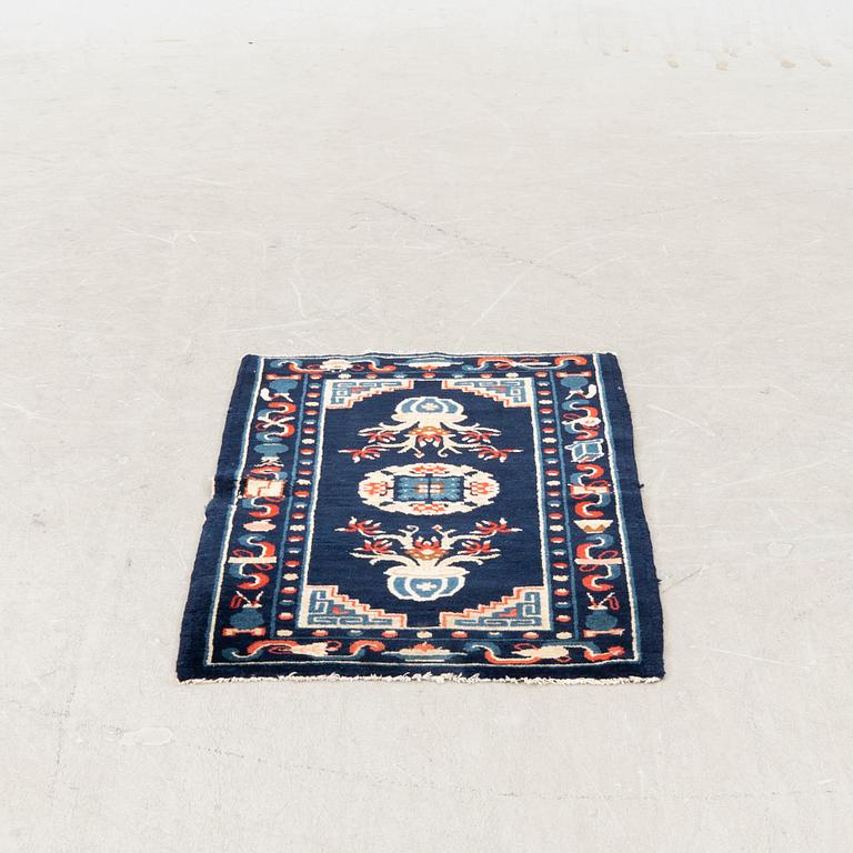 A semiantique Chinese Baotou carpet approx 106x58 cm.