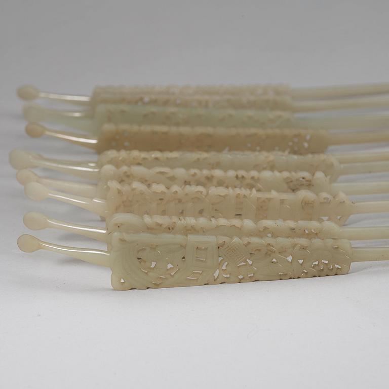 A set of ten carved pale celadon nephrite hairpins, late Qing dynasty (1644-1912).