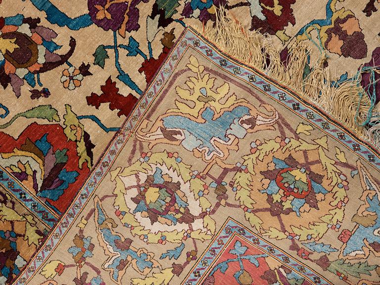 A RUG. An antique silk Kashan so called Motachem. 202,5 x 136,5 cm.