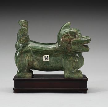 A nephrite figure of a Buddhist Lion, late Qing dynasty.