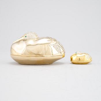 Judith Leiber, a clutch and pill box.