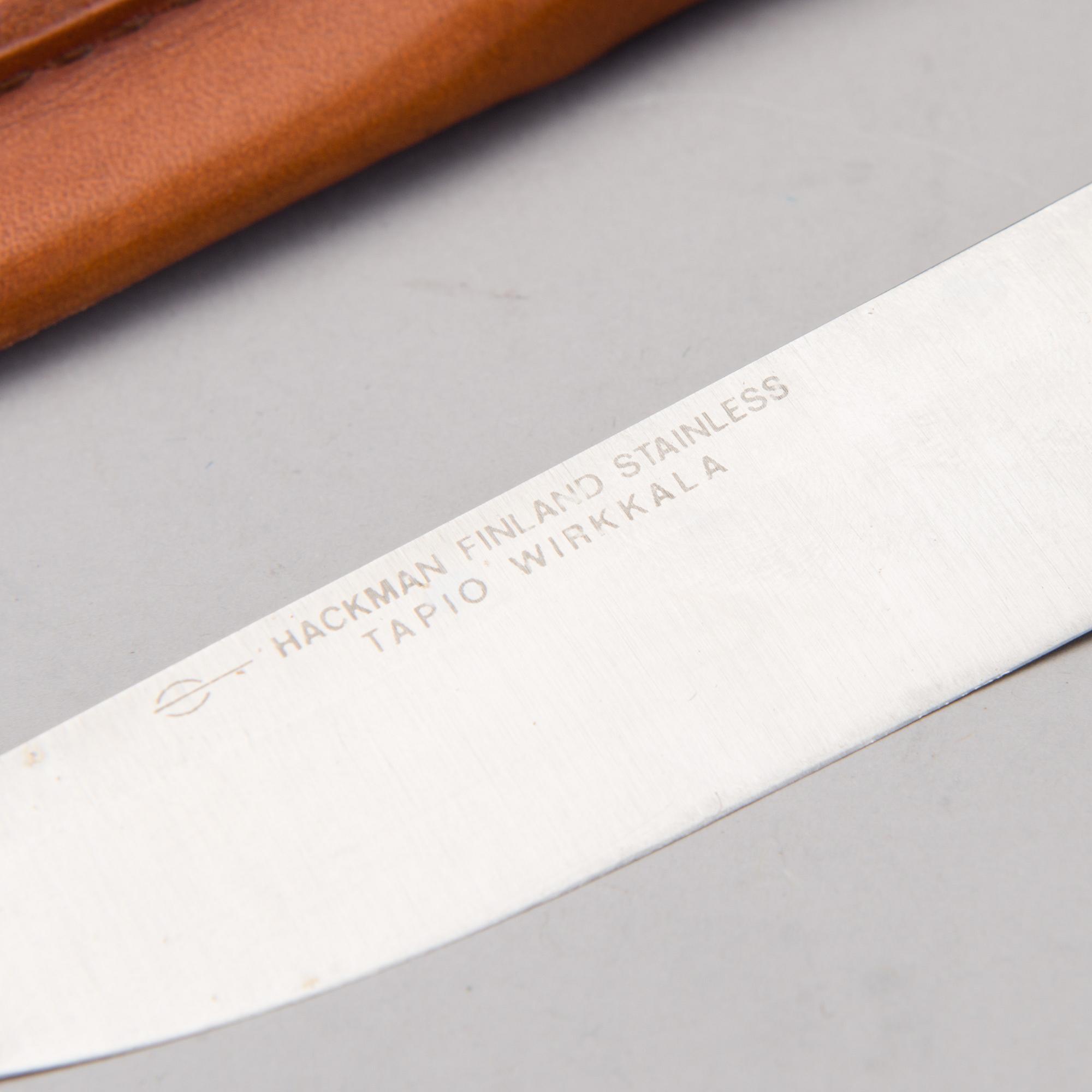 A Finnish puukko knife in stainless steel, nylon and brass