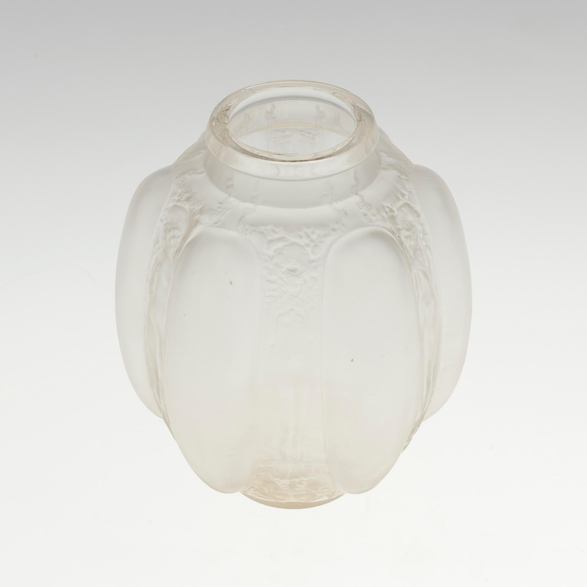 A René Lalique 'Six figurines et masques' moulded glass vase, France 1920-30's.