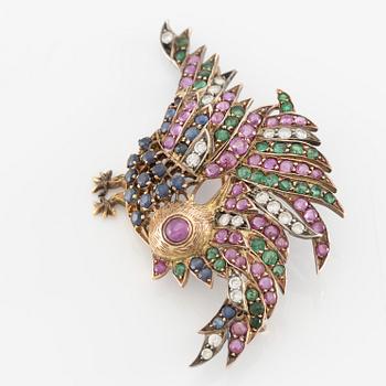 Brosch i form av fågel 14K guld med rubiner, diamanter, safirer och smaragder.