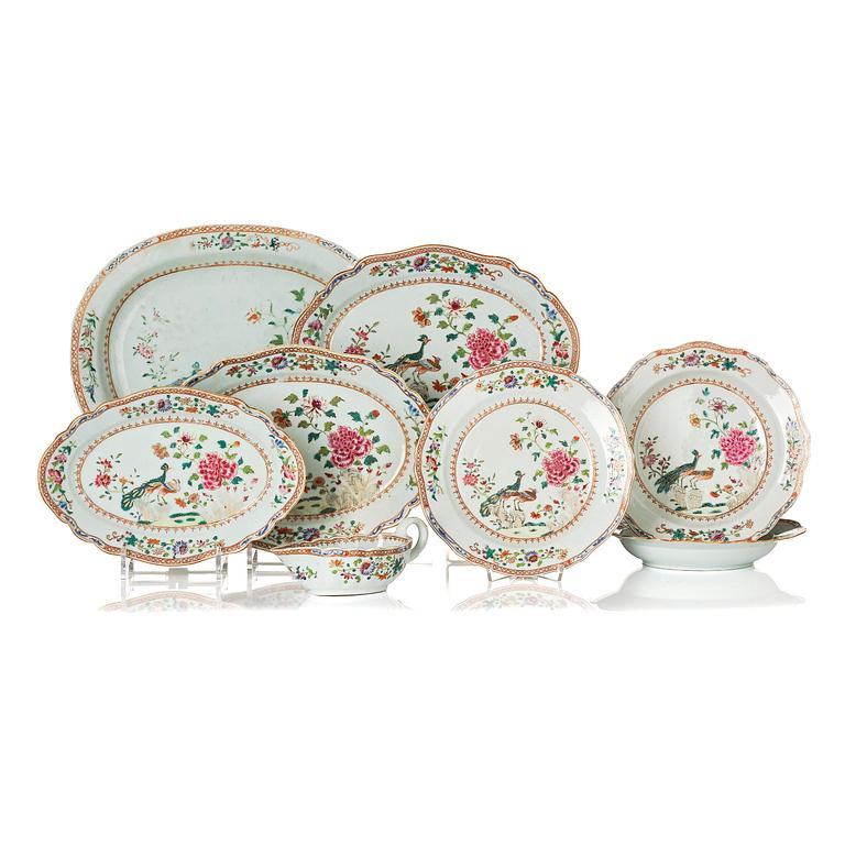 A group of famille rose 'double peacock' serving dishes, Qing dynasty, Qianlong (1736-95). (8 pieces).