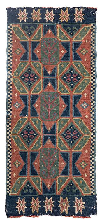 A carriage cushion, double-interlocked tapestry, c. 102 x 48 cm, Scania, Sweden, last quarter of the 18th century.