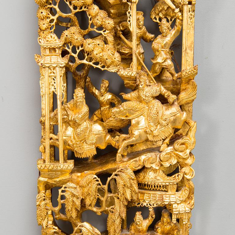 A Chinese carved and gilt wood panel, 20th century.