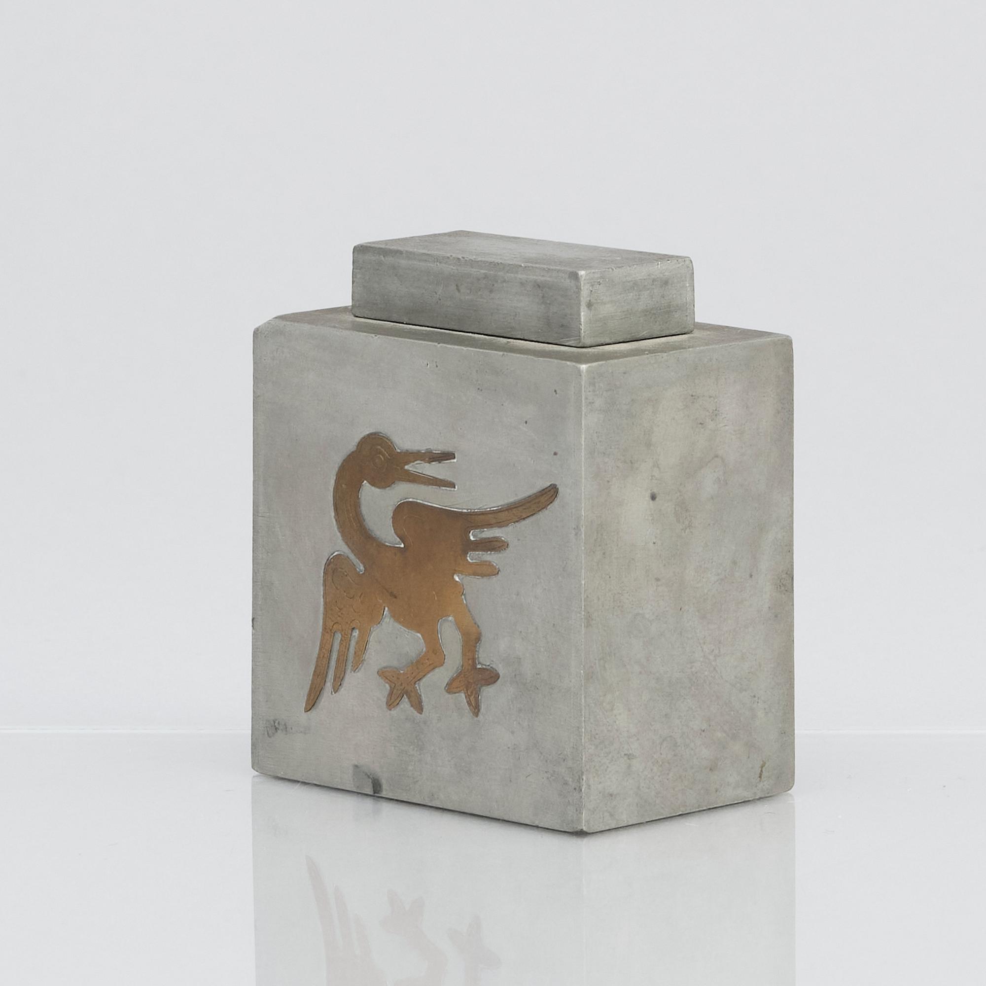 Firma Svenskt Tenn, a pewter lidded cannister with brass decor, Stockholm 1929.