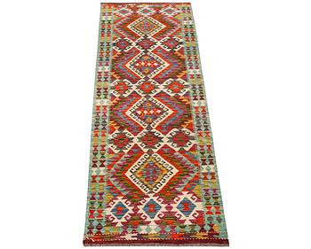 An Afghan kilim runner, c. 294 x 82 cm.