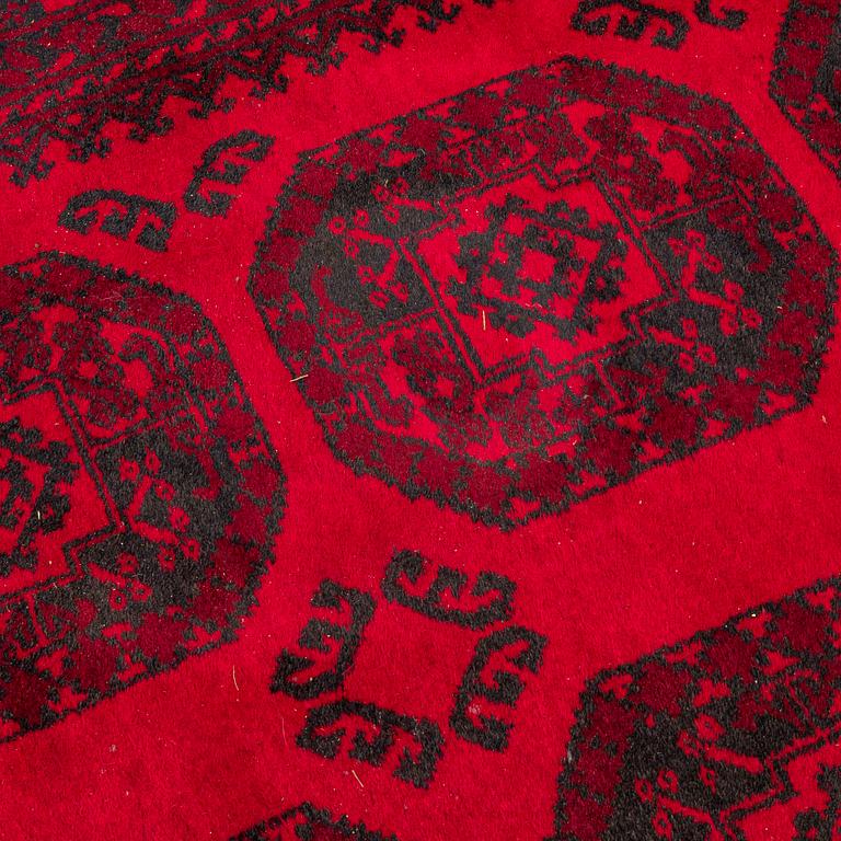 Two Afghan carpets. Ca. 326 x 217 and 88 x 63 cm.