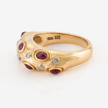 A W.A. Bolin ring in 18K gold with cabochon-cut rubies and eight-cut diamonds.