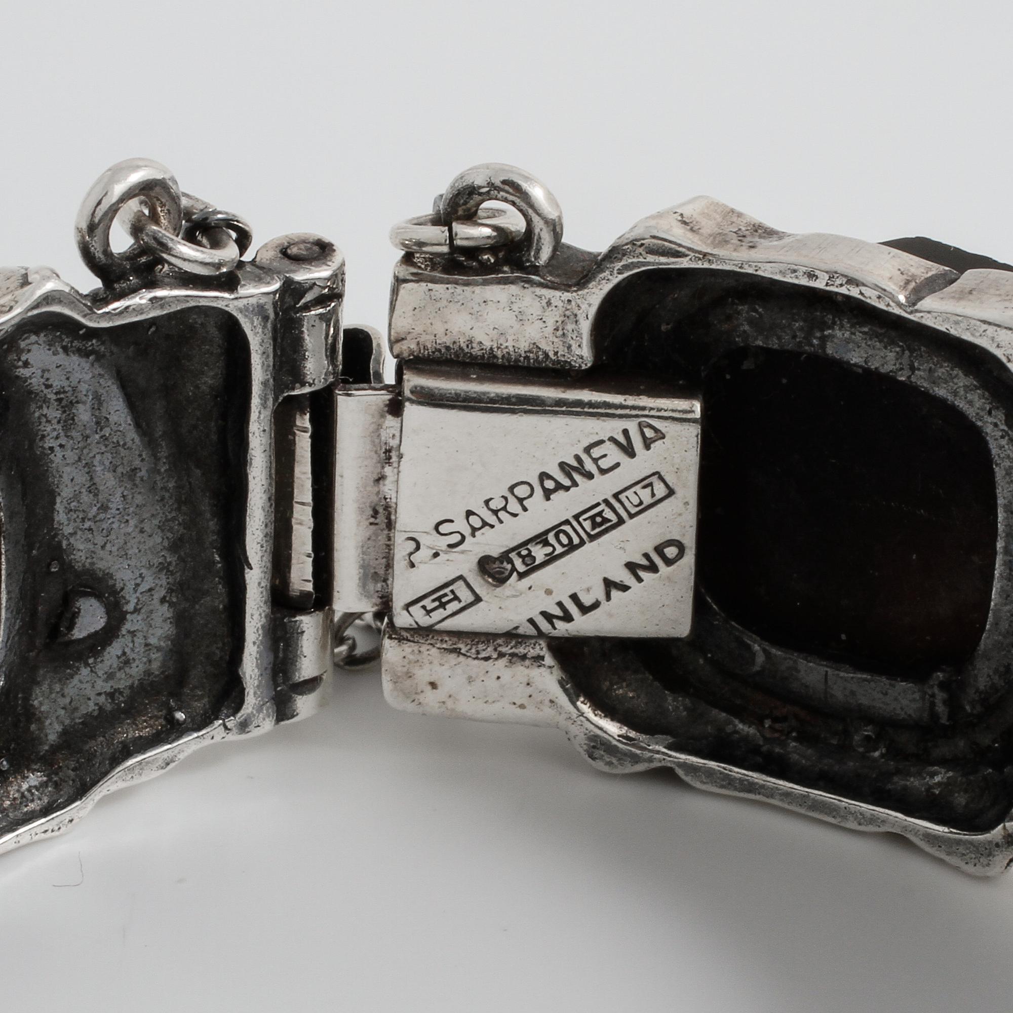 PENTTI SARPANEVA, Turku, 1973, a obsidian bracelet.