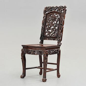 621. A Chinese wooden chair, Qing dynasty, 19th Century.