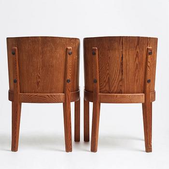 Axel Einar Hjorth, a pair of stained pine "Lovö" chairs, Nordiska Kompaniet, 1930's.