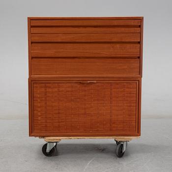 A 1960's teak shelving system by Poul Cadovius.