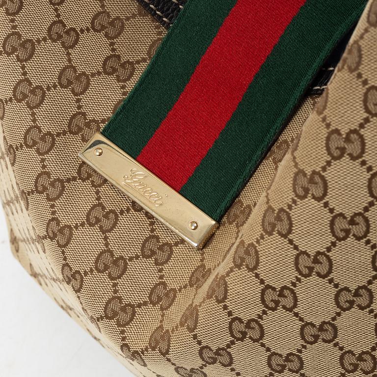 Gucci, GG Supreme bag.