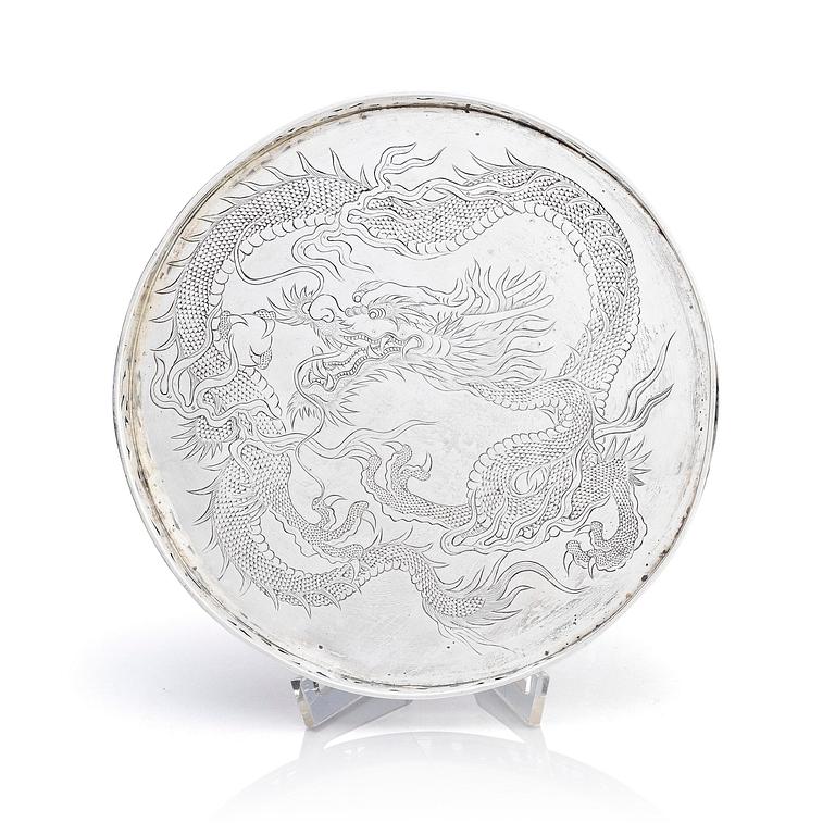 A Chinese Export silver tray with a dragon, early 20th century.