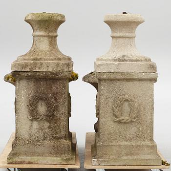 Garden urns, a pair on pedestals, 20th century.