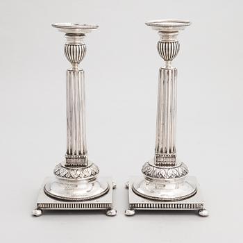 A pair of Swedish silver candlesticks, CG Hallberg, Stockholm 1901 and 1902.