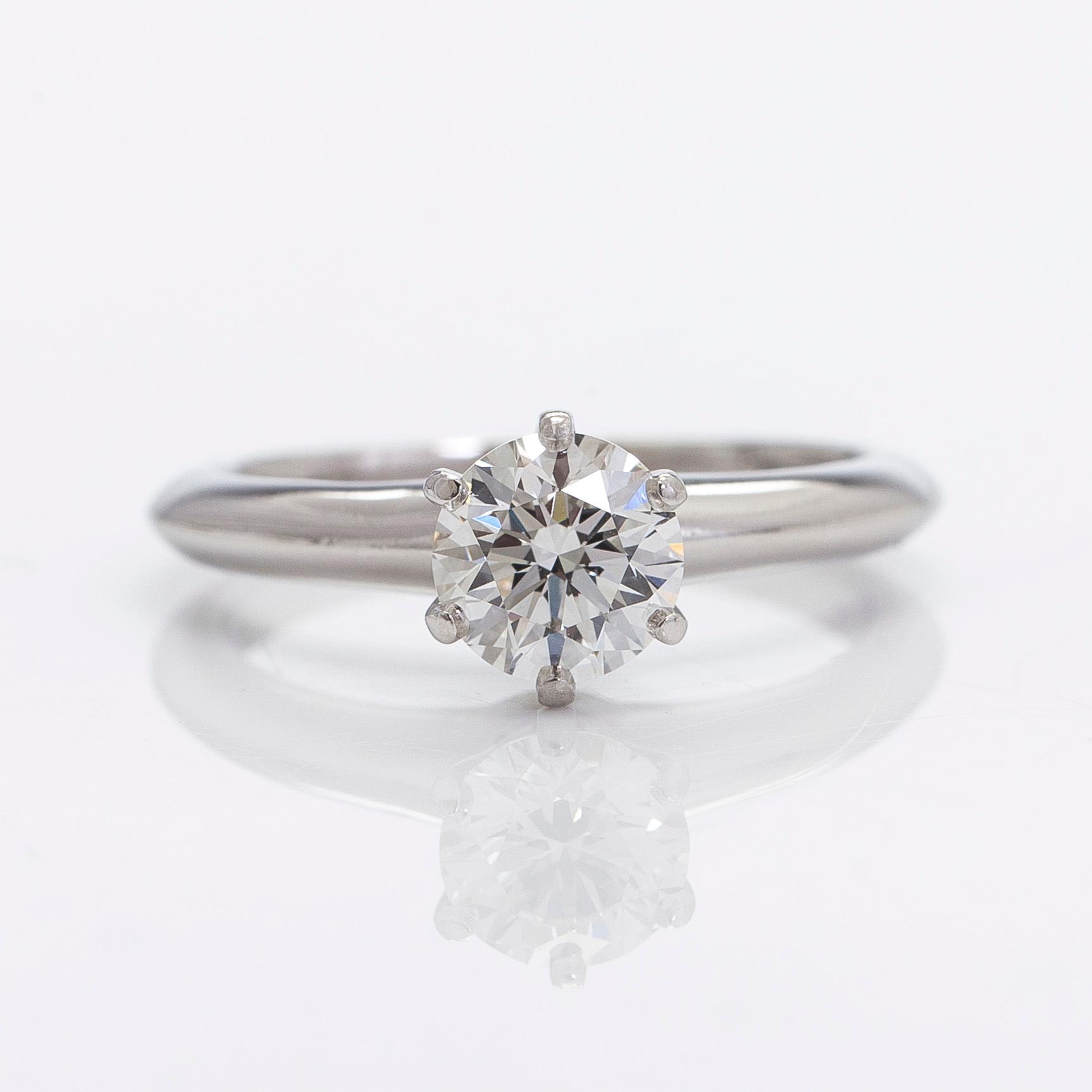 Tiffany & Co, a platinu solitaire ring with a brilliant-cut diamond.
