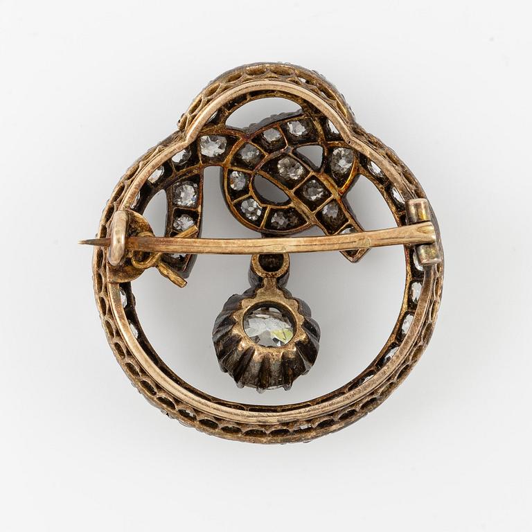 A brooch, silver and gold set with old-cut diamonds.
