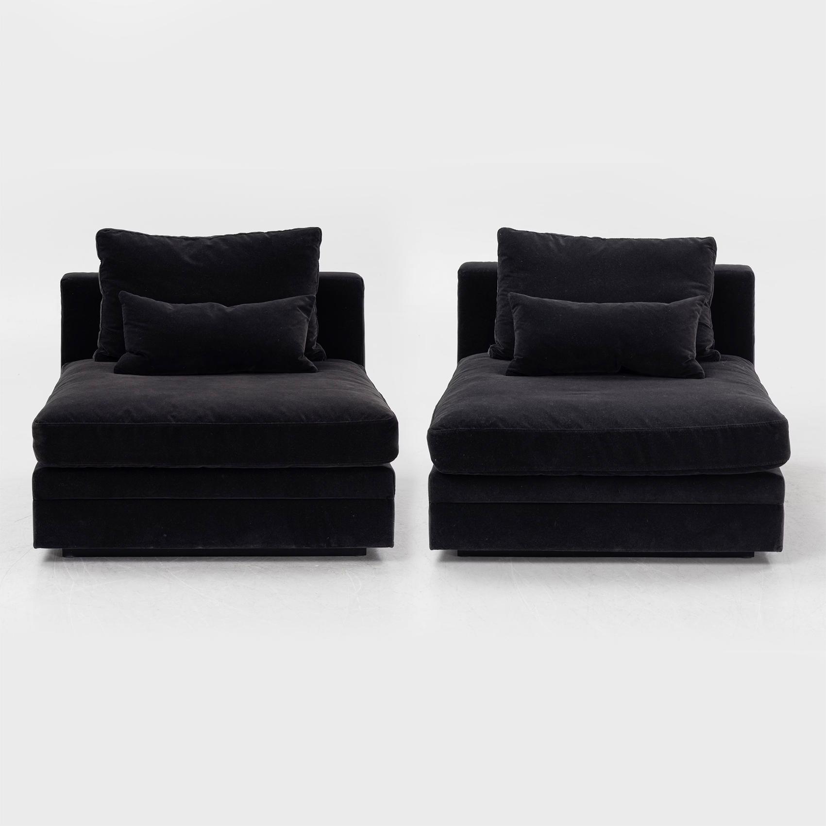 Two 21st century lounge chairs.